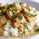 creamy smothered chicken and rice - featured image