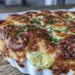 creamy au gratin potatoes with three cheeses - featured image